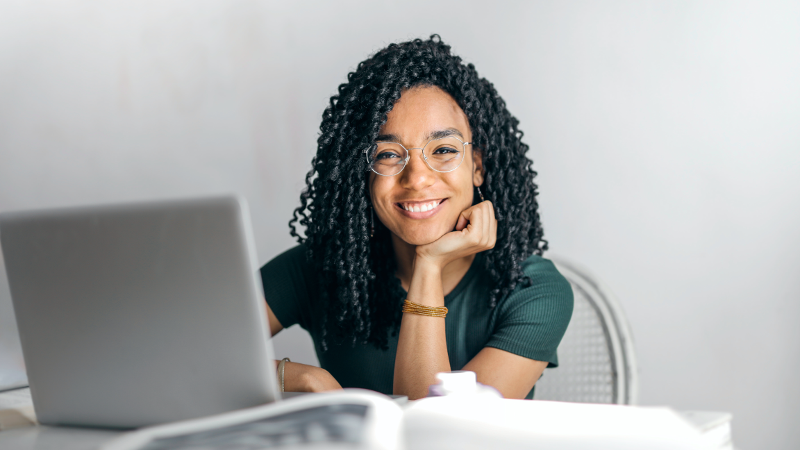 Happy woman using a laptop.